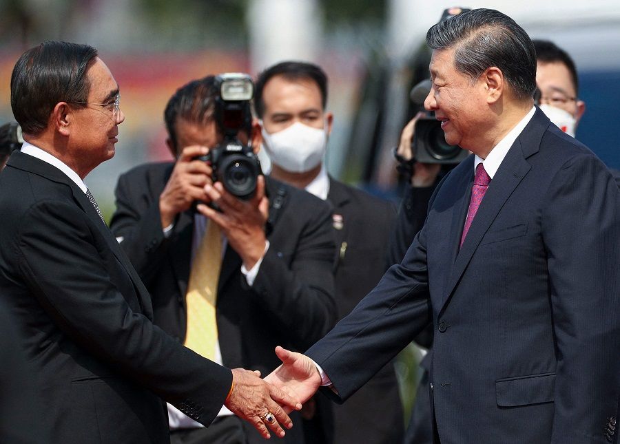 Chinese President Xi Jinping shakes hands with Thailand's Prime Minister Prayuth Chan-o-cha on the sidelines of the Asia-Pacific Economic Cooperation (APEC) summit in Bangkok, Thailand, on 19 November 2022. (Athit Perawongmetha/Pool/AFP)