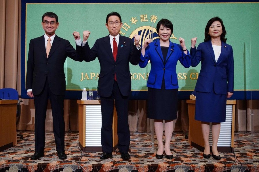 Candidates for the presidential election of the ruling Liberal Democratic Party, (from left to right) Taro Kono, the cabinet minister in charge of vaccinations, Fumio Kishida, former foreign minister, Sanae Takaichi, former internal affairs minister, and Seiko Noda, former internal affairs minister, pose for photographers prior to a debate session at the Japan National Press Club in Tokyo on 18 September 2021. (Eugene Hoshiko/AFP)