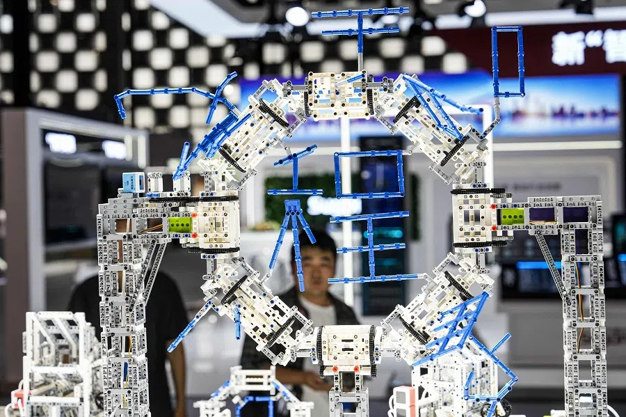 People visit the World Artificial Intelligence Conference (WAIC) in Shanghai, China, on 4 July 2024. (AFP)