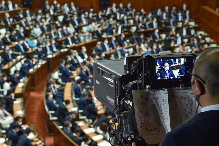 A television camera shows the leader of Japan's ruling Liberal Democratic Party (LDP) Fumio Kishida (right) during the lower house plenary session of parliament to elect the new prime minister in Tokyo on 4 October 2021. (Kazuhiro Nogi/AFP)