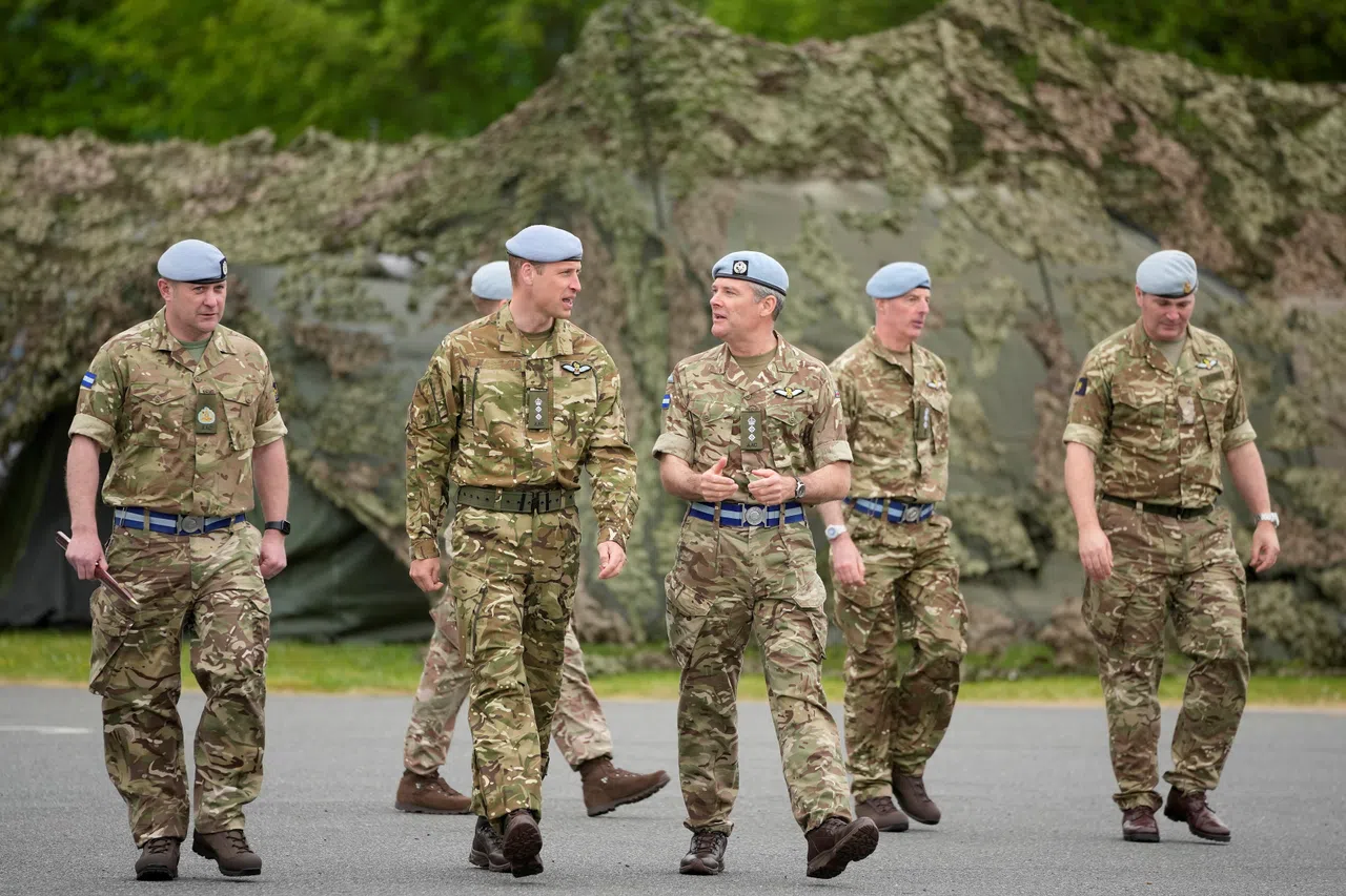 Britain’s Prince William, Prince of Wales, speaks to military personnel, after he was handed over the role of colonel-in-chief of the Army Air Corps, at the Army Aviation Centre in Middle Wallop, the UK, on 13 May 2024. (Kin Cheung/Pool via Reuters)
