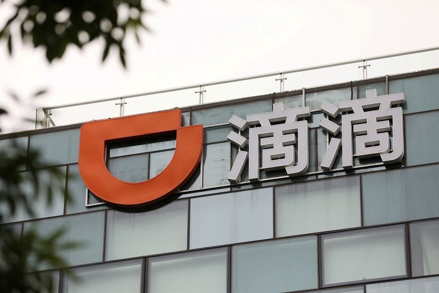 A sign of Chinese ride-hailing service Didi is seen on its headquarters in Beijing, China, on 5 July 2021. (Tingshu Wang/Reuters)