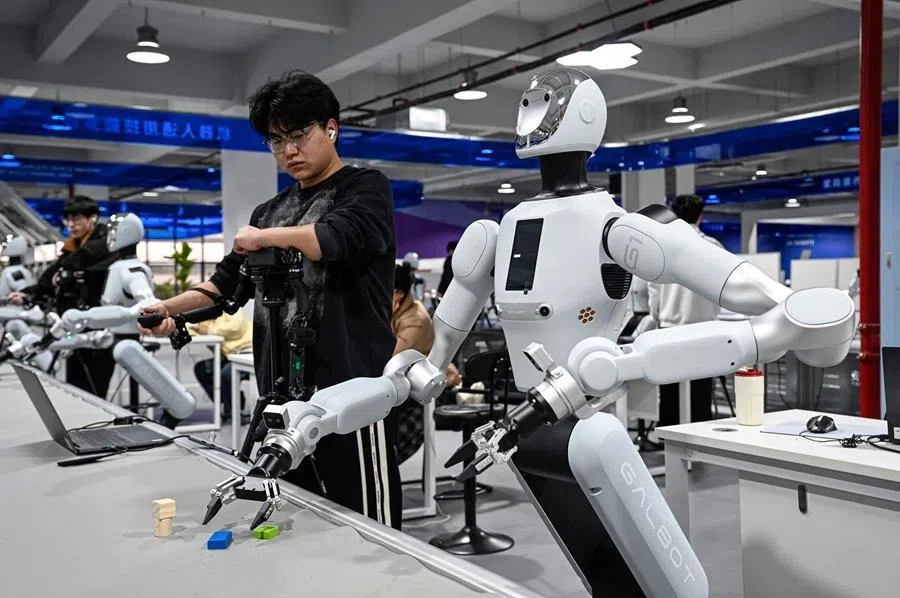 The photo taken on 11 March 2026 shows technicians conducting robot training at a robot data training centre of Miracle Automation Engineering Company in Wuxi, Jiangsu province, China.