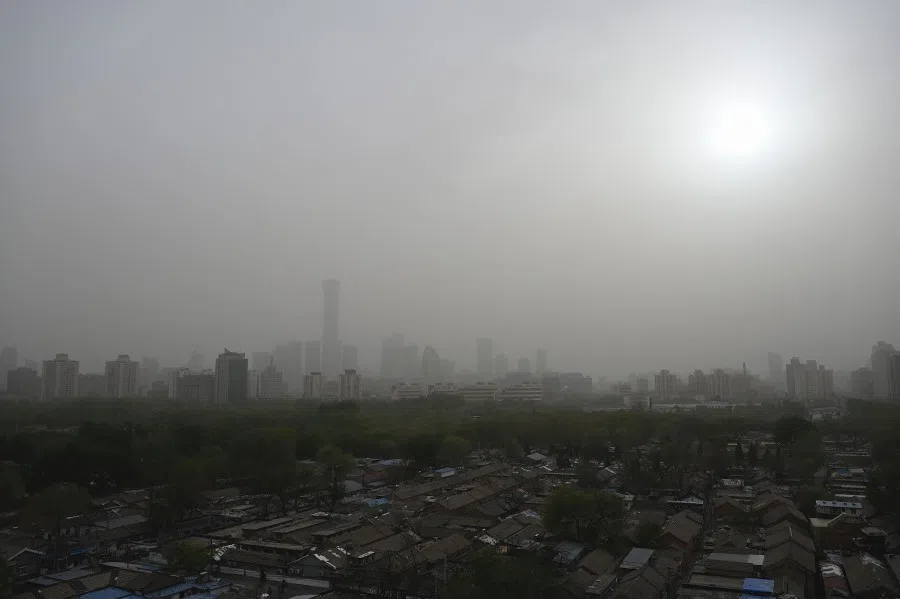 High-rise buildings (back) at central business district are seen on a severely polluted day in Beijing on 12 April 2023. (Jade Gao/AFP)
