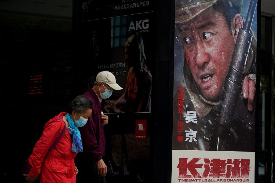 A poster advertising The Battle at Lake Changjin, a film directed by mainland China and Hong Kong directors, is displayed at a movie theatre in Shanghai, China, 19 October 2021. (Aly Song/Reuters)