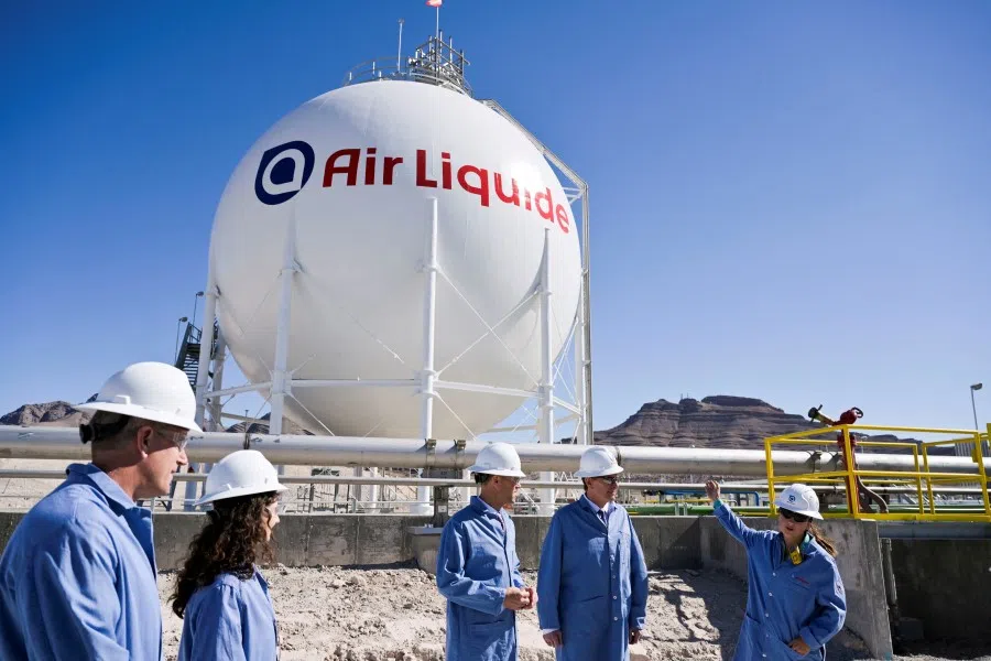 A sphere that stores liquid hydrogen is explained by plant engineer Hannah Nelson during a tour as Air Liquide opens its North Las Vegas Hydrogen Production facility, supplying California's mobility market, in Las Vegas, Nevada, US, 24 May 2022. (Bridget Bennett/Reuters)