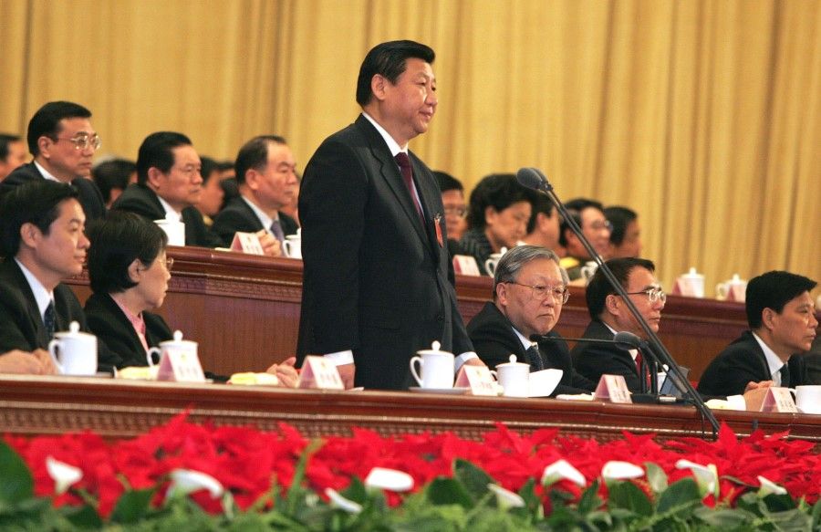 Xi Jinping (standing) at a session of the 11th National People's Congress in 2008. (CNS)