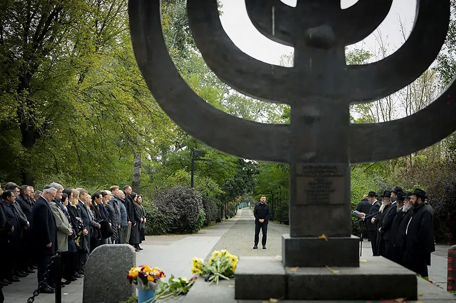 In this handout photograph taken and released by the Ukrainian Presidential Press Service on 29 September 2025, Ukraine's President Volodymyr Zelenskyy attends the memorial ceremony at the Babyn Yar National Historical Memorial Preserve to mark the 84th anniversary of the mass execution of civilians, mainly Jewish people, by the Nazis during the World War II. (Handout/Ukrainian Presidential Press Service/AFP)