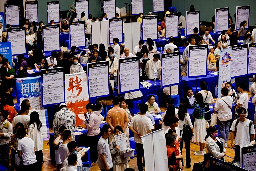 This photo taken on 2 June 2024 shows people attending a job fair in Huai’an, in eastern China’s Jiangsu province. (AFP)