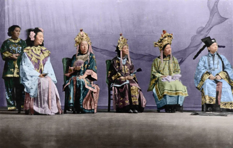 Chinese immigrants on stage giving a traditional Chinese performance in Portland.