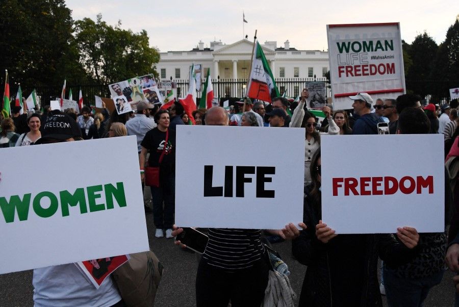 Protesters march in solidarity with protesters in Iran in front of the White House in Washington, DC, on 22 October 2022. Iran has been rocked by protests since 22-year-old Mahsa Amini's death on 16 September, three days after she was arrested by morality police in Tehran for allegedly violating the Islamic republic's strict dress code for women. (Olivier Douliery/AFP)