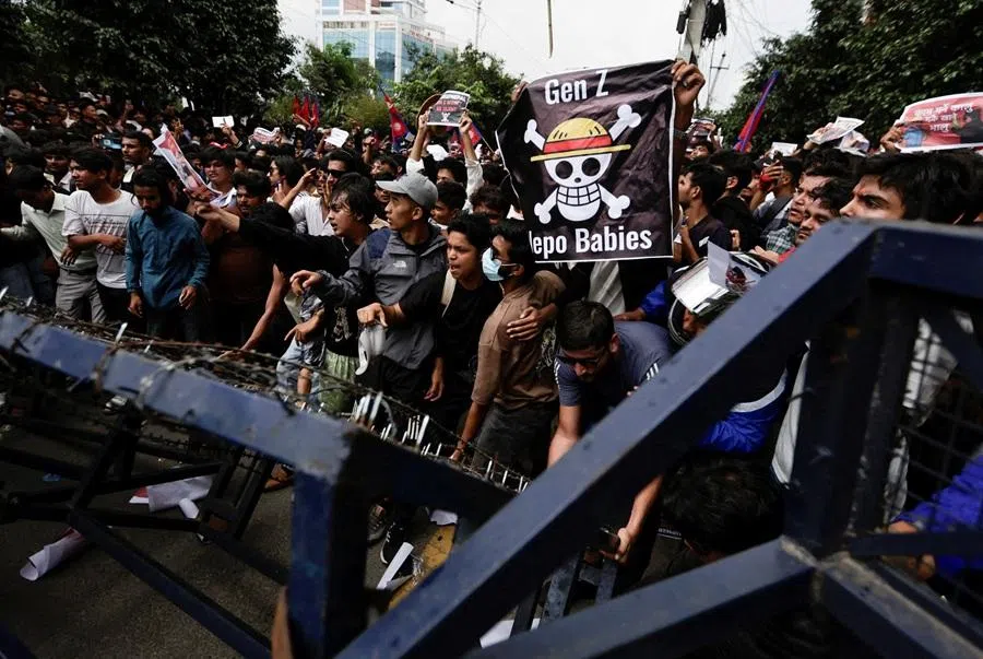 Demonstrators push through police barricades while storming Nepal's Parliament during youth led protests that toppled Nepal's prime minister, in Kathmandu, Nepal, on 8 September 2025. (Navesh Chitrakar/Reuters)