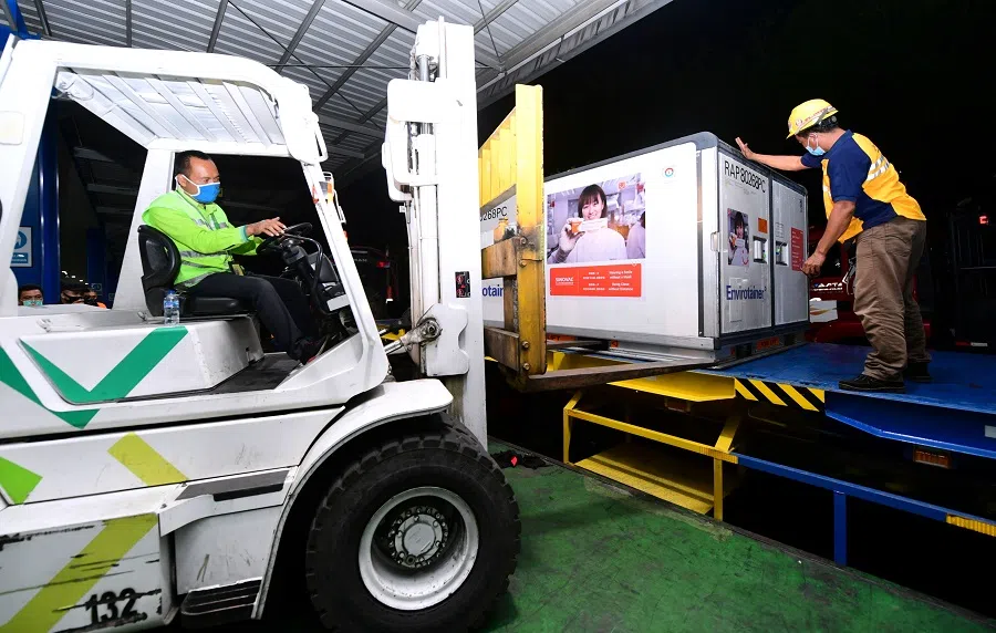 Containers with Covid-19 vaccines from China's Sinovac Biotech Ltd. are seen prepared to be brought to PT Bio Farma (Persero), in the first shipment to Indonesia at Soekarno-Hatta International Airport in Tangerang near Jakarta, Indonesia, 7 December 2020. (Courtesy of Muchlis Jr/Indonesian Presidential Palace/Handout via Reuters)
