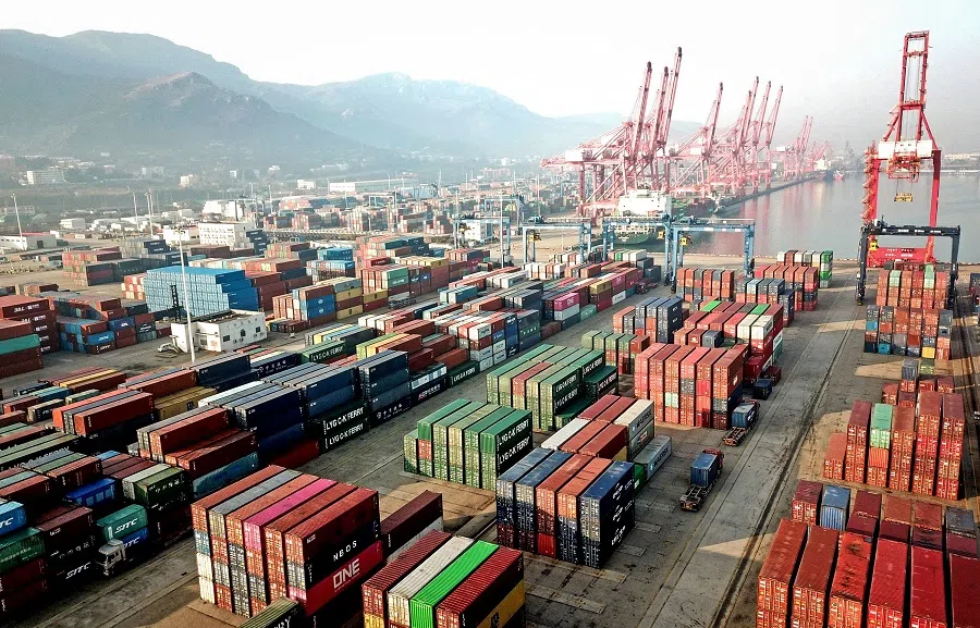 This aerial photo taken on 7 December 2021 shows containers stacked at a port in Lianyungang, Jiangsu province, China. (AFP)
