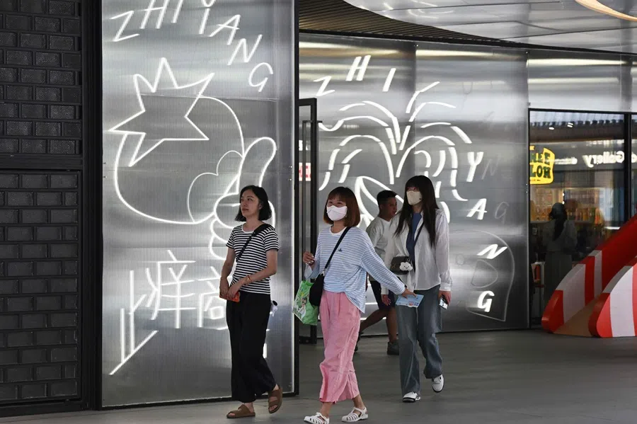People visit a recently opened shopping complex in downtown Beijing, China, on 18 June 2025. (Adek Berry/AFP)