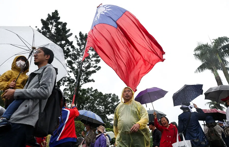 A protester waves Taiwan’s national flag during a protest against Taiwan President Lai Ching-te in Taipei on 26 April 2025.