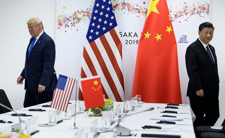 In this file photo taken on 29 June 2019, US President Donald Trump and Chinese President Xi Jinping attend a bilateral meeting on the sidelines of the G20 Summit in Osaka. (Brendan Smialowski/AFP)