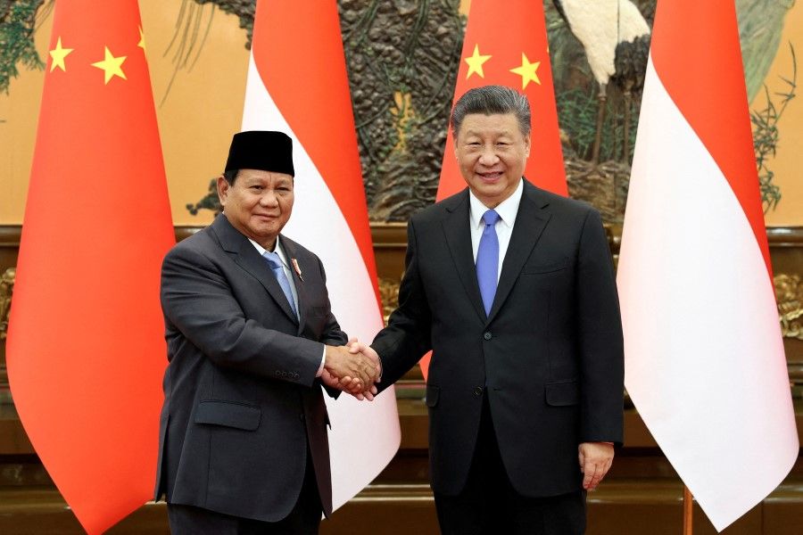 Chinese President Xi Jinping (right) and Indonesia's President-elect Prabowo Subianto shake hands at the Great Hall of the People in Beijing, China, on 1 April 2024. (China Daily via Reuters)