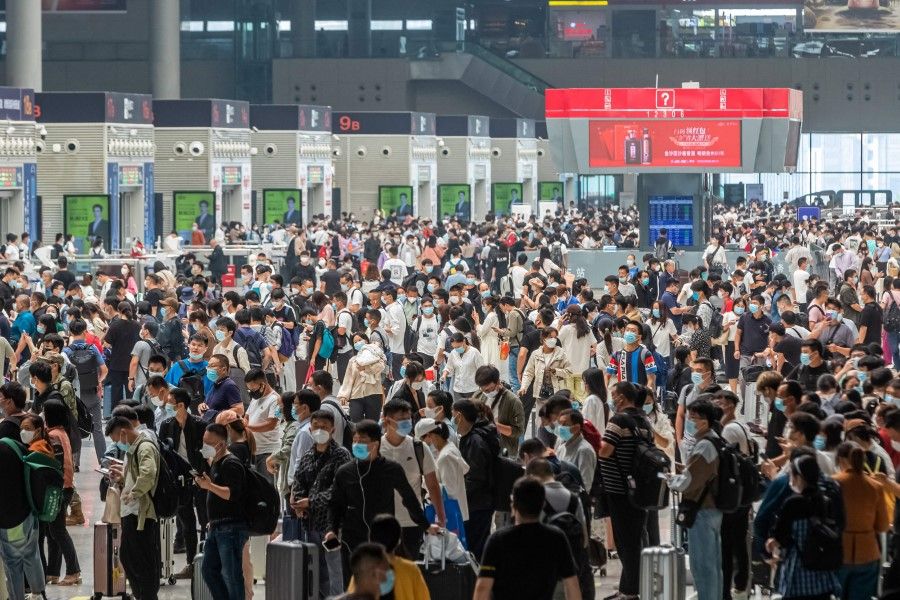 Passengers crowd Zhengzhou East Railway Station one day ahead of the National Day holidays, in Zhengzhou in China's central Henan province on 30 September 2022. (AFP)