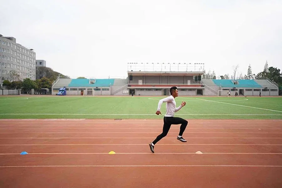 A passionate athlete, Li Chengcheng still spends his free time between training sessions to practise sprinting.