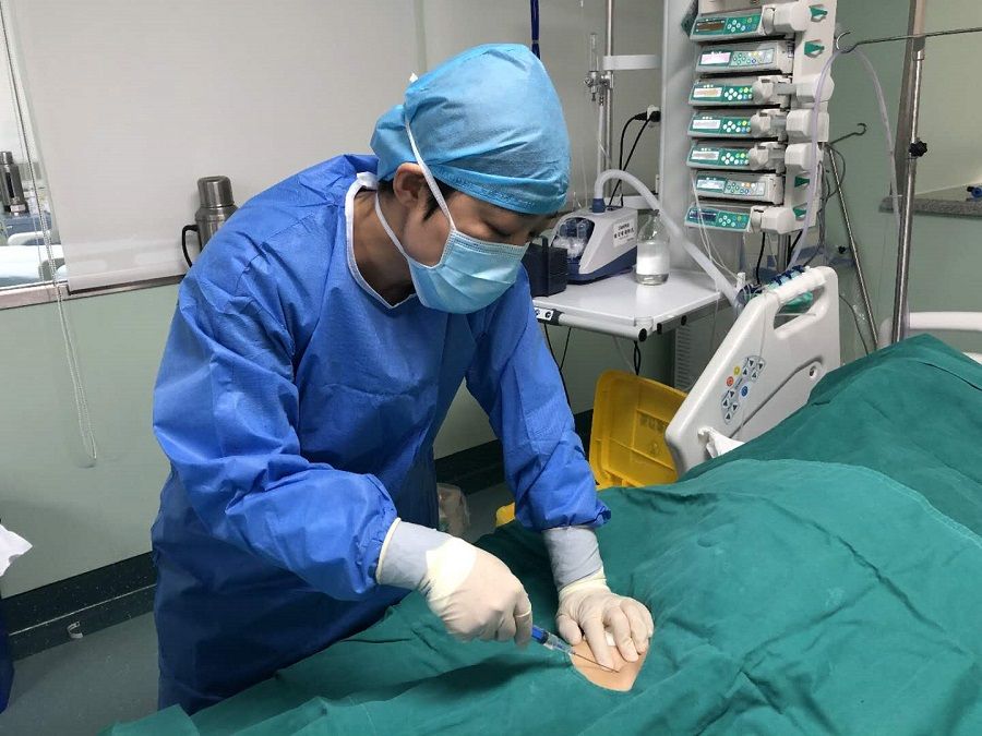 Dr Li Yan attending to a patient.