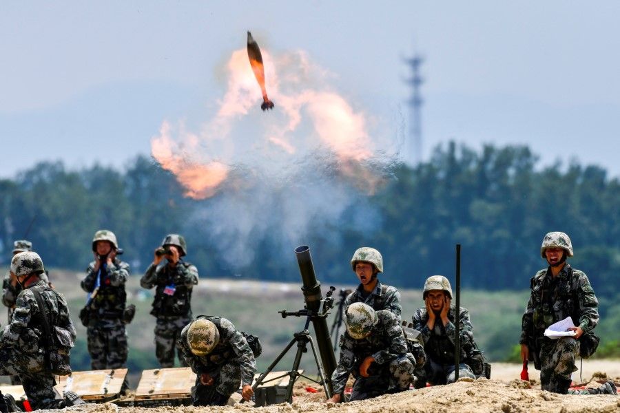 Soldiers of the Chinese People's Liberation Army (PLA) fire a mortar during a live-fire military exercise in Anhui province, China, 22 May 2021. (cnsphoto via Reuters)