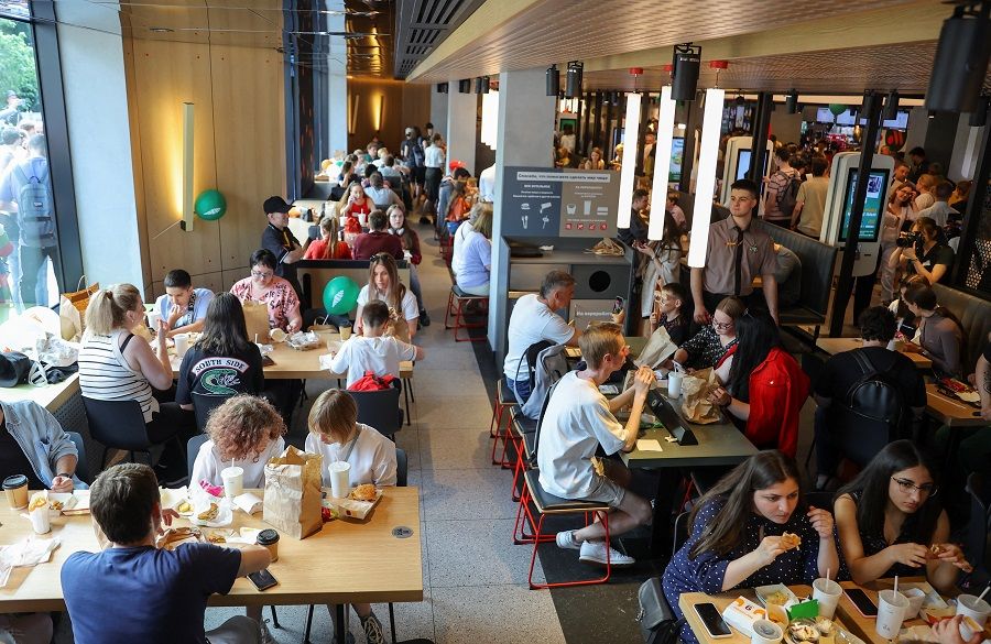 People visit the new restaurant Vkusno & tochka which opened following McDonald's exit from the Russian market, in Moscow, Russia, 12 June 2022. (Evgenia Novozhenina/Reuters)