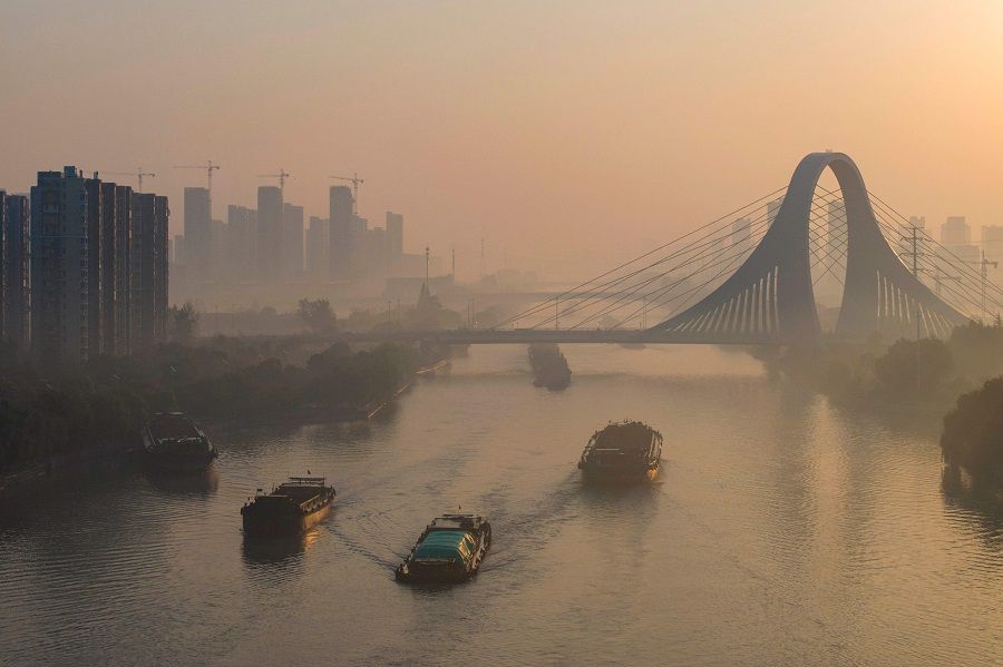 Barges sail on the Grand Canal in Huaian, in China's eastern Jiangsu province on 26 October 2023. (AFP)
