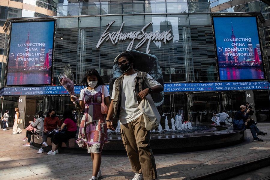 People walk through Exchange Square in Hong Kong, China, on 28 October 2022. (Isaac Lawrence/AFP)