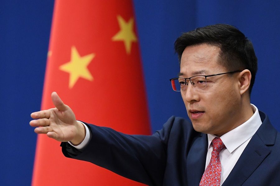 Chinese foreign ministry spokesperson Zhao Lijian takes a question at the daily media briefing in Beijing on 8 April 2020. (Greg Baker/AFP)