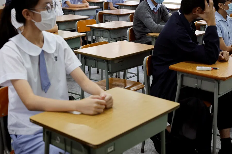 Empty seats are seen inside a classroom of a secondary school on the first day of the new term in Hong Kong, China, 1 September 2021. (Tyrone Siu/File Photo/Reuters)