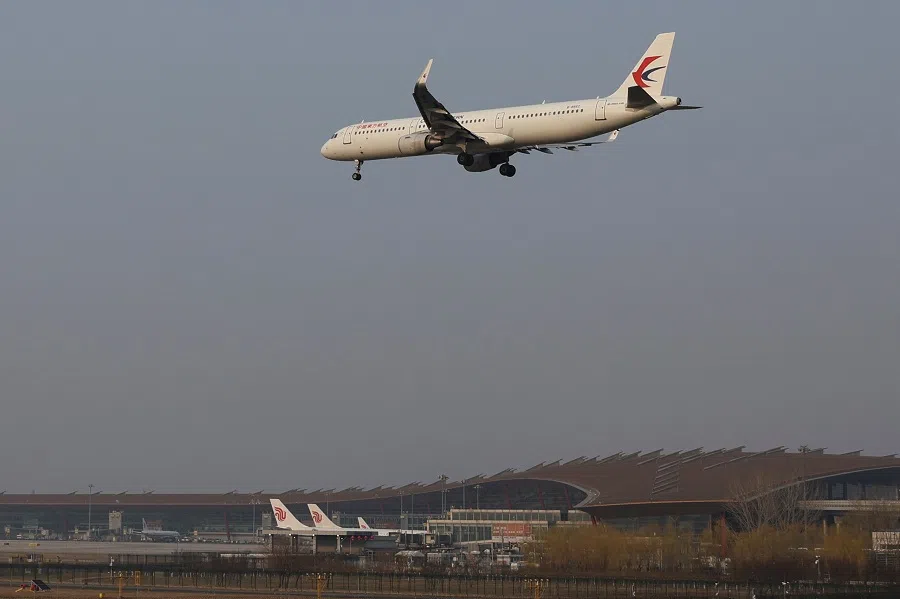 A plane of China Eastern Airlines lands at the Beijing Capital International Airport in Beijing, China, 23 March 2022. (Tingshu Wang/Reuters)
