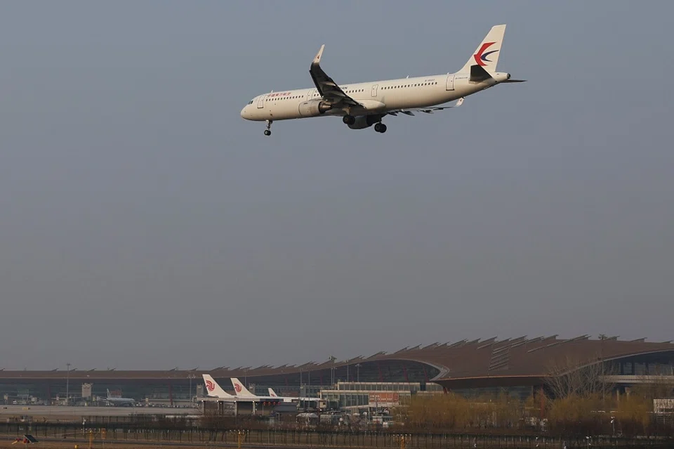 A plane of China Eastern Airlines lands at the Beijing Capital International Airport in Beijing, China, 23 March 2022. (Tingshu Wang/Reuters)