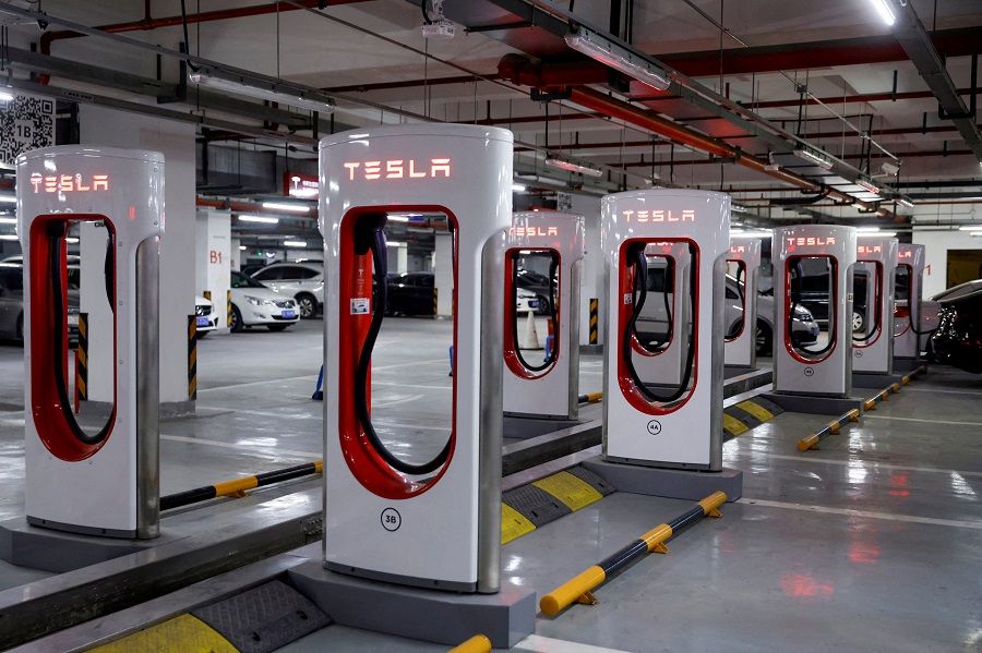Tesla charging stations are pictured in a parking lot in Shanghai, China, on 13 March 2021. (Aly Song/File Photo/Reuters)