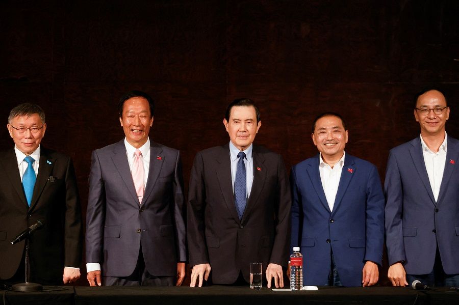 Ko Wen-je, Taiwan People's Party (TPP) chairman and presidential candidate, Terry Gou, Foxconn founder and presidential candidate, former Taiwan President Ma Ying-jeou, Hou Yu-ih presidential candidate of the main opposition party Kuomintang (KMT) and Eric Chu, Kuomintang's Chairman attend a press conference in Taipei, Taiwan, on 23 November 2023. (Carlos Garcia Rawlins/Reuters)