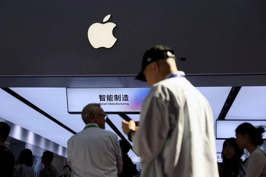 People walk past a booth showcasing Apple's suppliers during the China International Supply Chain Expo (CISCE) in Beijing, China, on 22 June 2026.