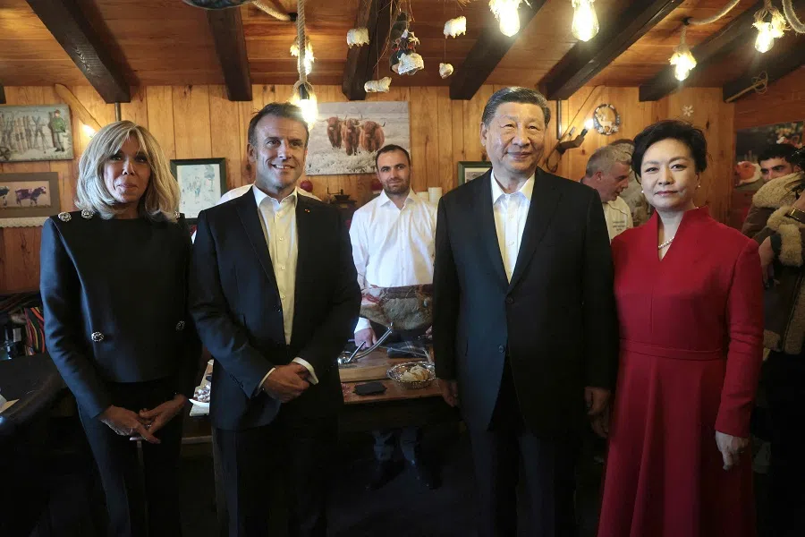 Chinese President Xi Jinping and his wife Peng Liyuan pose with French President Emmanuel Macron and his wife Brigitte Macron in a restaurant at the Tourmalet pass, in the Pyrenees mountains, as part of his two-day state visit to France, on 7 May 2024.
