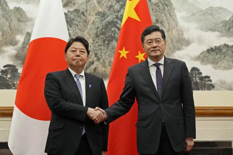Japan's Foreign Minister Yoshimasa Hayashi meets Chinese Foreign Minister Qin Gang during their meeting at the Diaoyutai State Guesthouse in Beijing, China in this photo taken by Kyodo on 2 April 2023. (Kyodo/via Reuters)