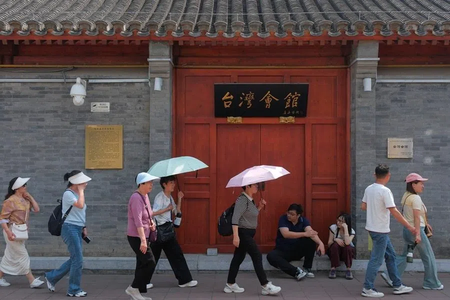 People walk past the Taiwan Assembly Hall, ahead of US President Donald Trump’s visit to China, in Beijing, China, on 13 May 2026.