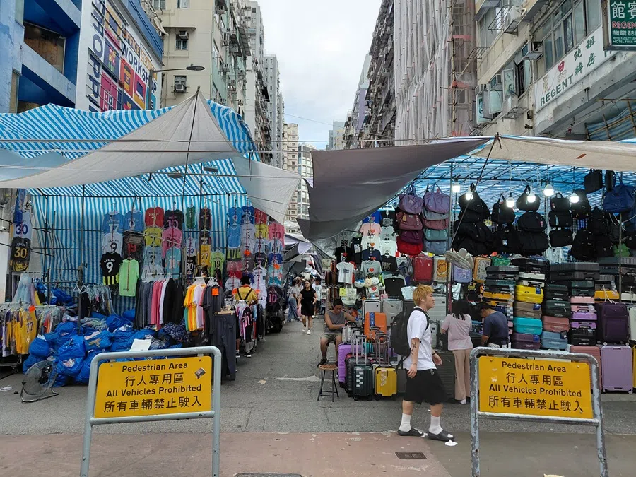 Tung Choi Street, also known as Ladies’ Street, a famous street in Hong Kong, home to numerous vendors selling a variety of clothing, accessories, toys and other goods, in July 2025. (Tai Hing Shing/SPH Media)