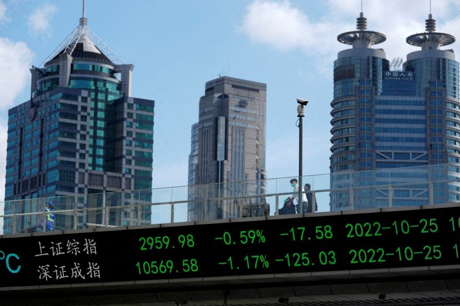 An electronic board shows Shanghai and Shenzhen stock indexes, at the Lujiazui financial district in Shanghai, China, on 25 October 2022. (Aly Song/Reuters)