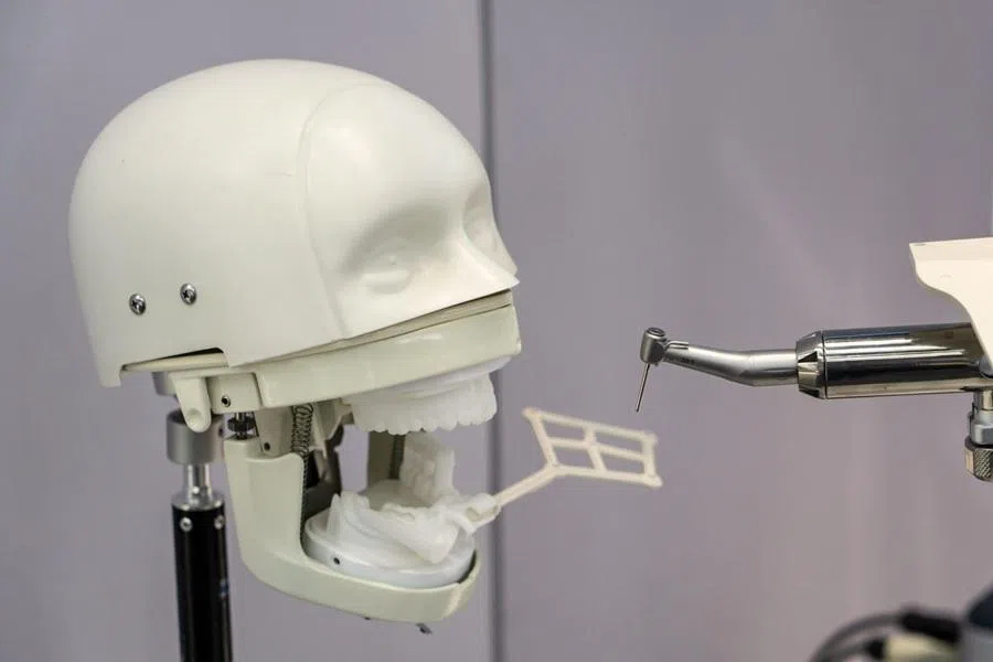 A robotic tooth implant procedure displayed in the exhibition hall at the Beijing Innovation Center of Humanoid Robotics, known as X-Humanoid, in Beijing, China, on 29 May 2026.