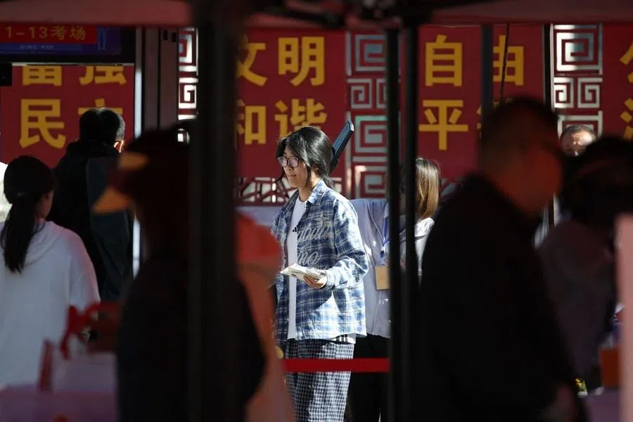 A student goes through a security check before sitting for exams on the first day of the gaokao, in Datong, Shanxi province, China, on 7 June 2026.