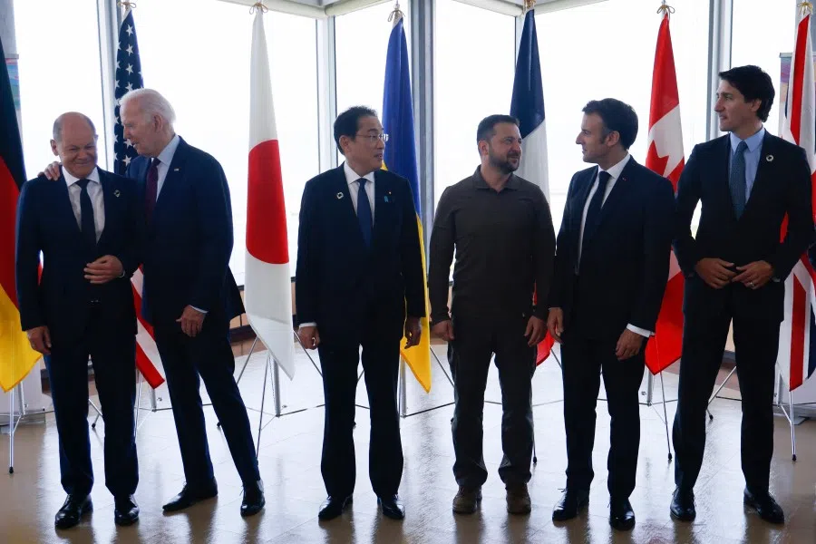 (L to R) Germany's Chancellor Olaf Scholz, US President Joe Biden, Japan's Prime Minister Fumio Kishida, Ukraine's President Volodymyr Zelensky, France's President Emmanuel Macron and Canada's Prime Minister Justin Trudeau at the G7 Leaders' Summit in Hiroshima on 21 May 2023, at which "de-risking" was discussed. (Ludovic Marin/AFP)