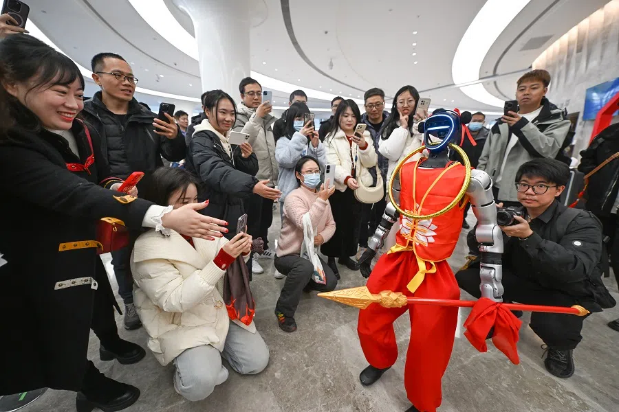 A robot version of the Chinese deity Nezha attracts a crowd at an event in Xihu district, Hangzhou, 26 February 2025.