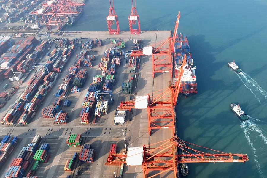 This aerial photo taken on 7 December 2022 shows cranes and shipping containers at a port in Lianyungang, Jiangsu province, China. (AFP)