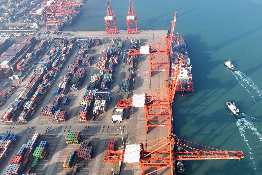 This aerial photo taken on 7 December 2022 shows cranes and shipping containers at a port in Lianyungang, Jiangsu province, China. (AFP)