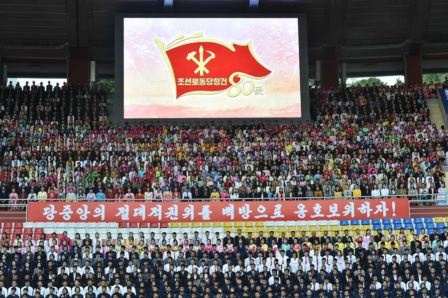 Spectators watch during a gathering to present letters of loyalty to North Korean leader Kim Jong Un, on the occasion of the 80th founding anniversary of the Worker's Party of Korea, at Kim Il Sung Stadium in Pyongyang on 7 October 2025.