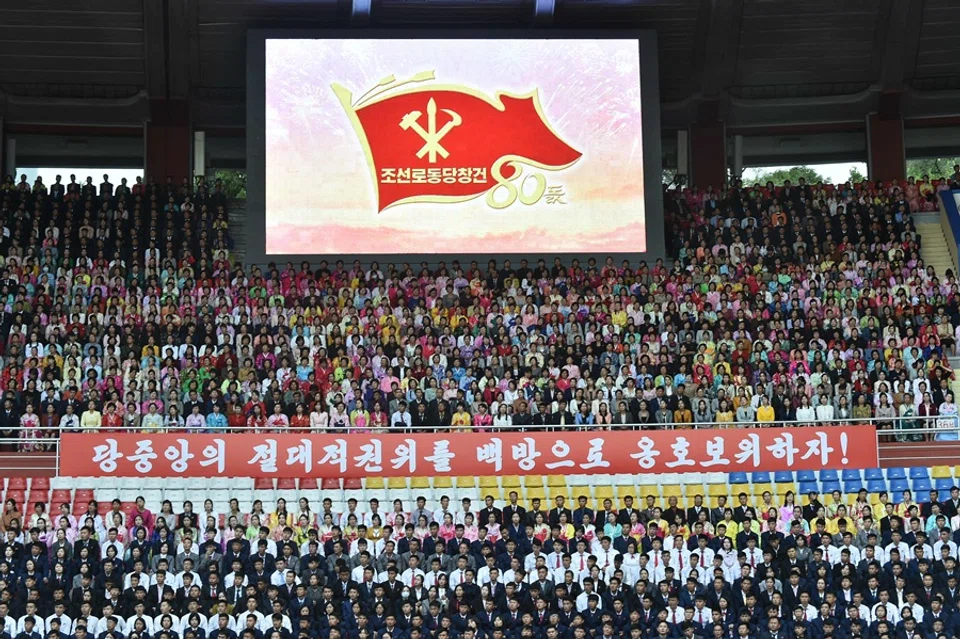 Spectators watch during a gathering to present letters of loyalty to North Korean leader Kim Jong Un, on the occasion of the 80th founding anniversary of the Worker's Party of Korea, at Kim Il Sung Stadium in Pyongyang on 7 October 2025. (Kim Won Jin/AFP)