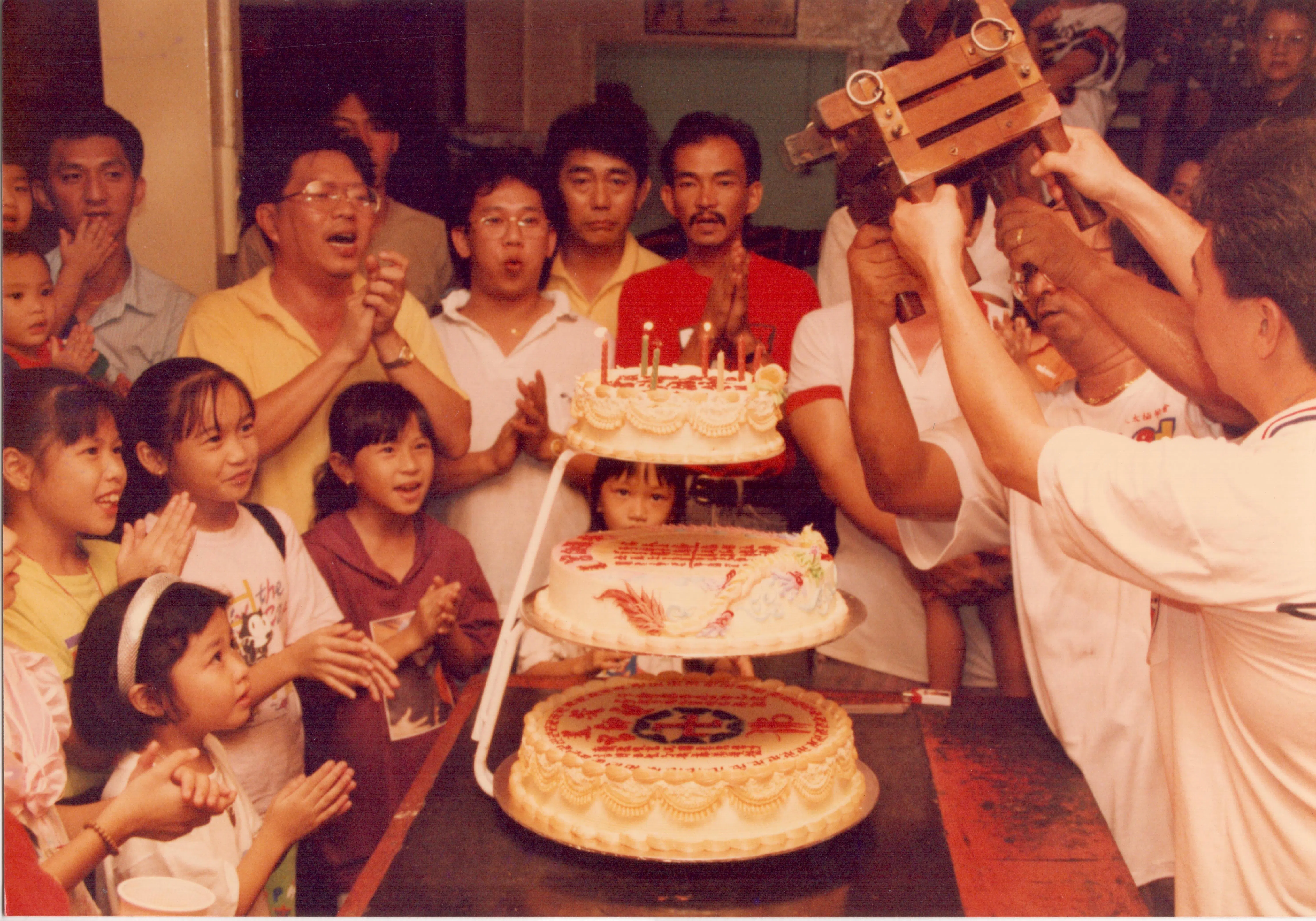 Temple members celebrating the birthday of a deity. I am at the bottom left of the picture. Brunei, circa 1995.